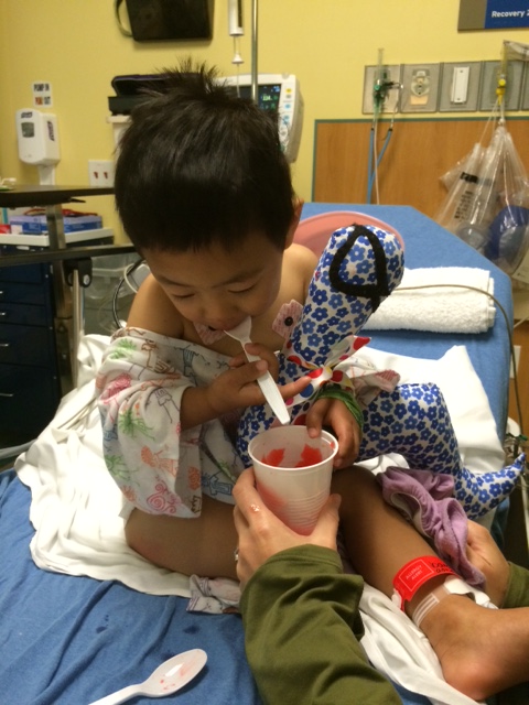 Eating the slushy with his stuffed book worm