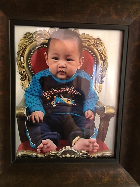 First photo of Edric in the traditional golden throne chair that all adopted little ones get taken