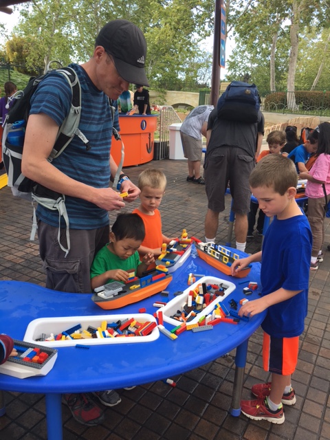 Everyone building a Lego boat